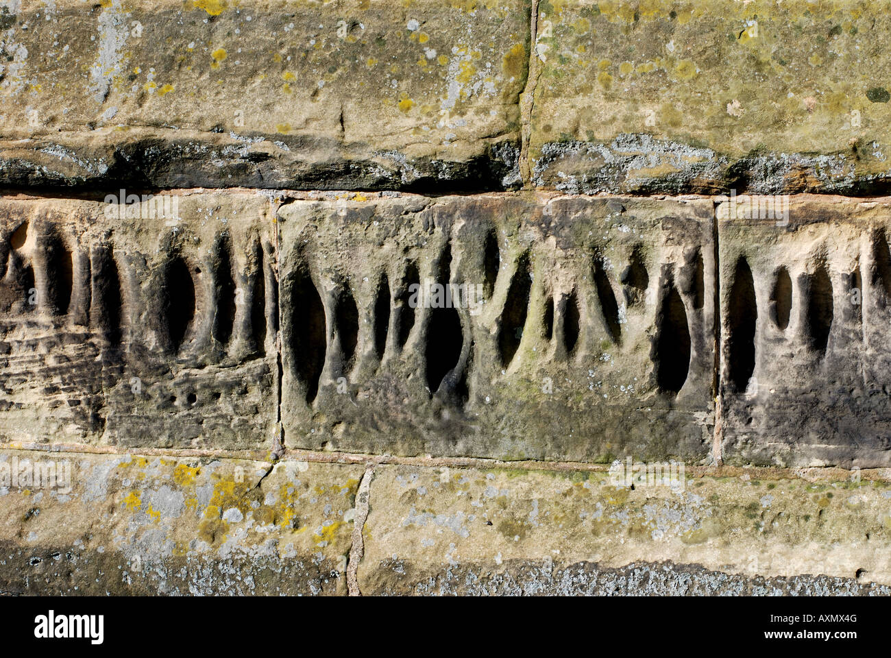 Sharpening marks on wall of St. Botolph`s Church, Burton Hastings
